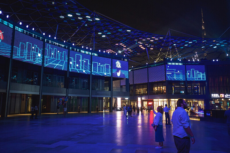 City Walk multimedia attraction illuminated at night