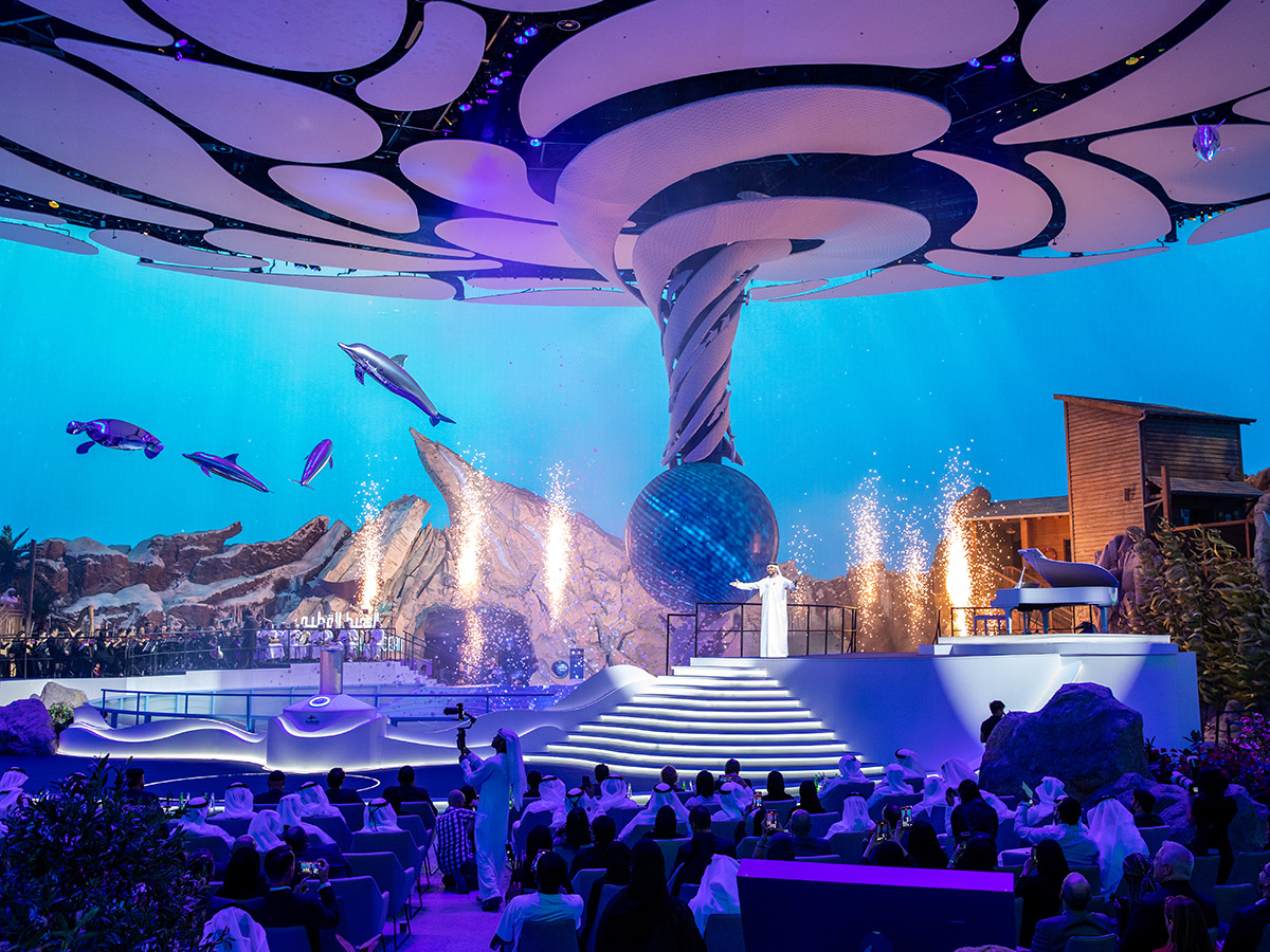 Grand opening celebration showing the vast indoor marine park with LED ceiling and aquarium projections